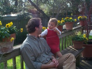 Chatting up Daddy on her birthday in 2005.