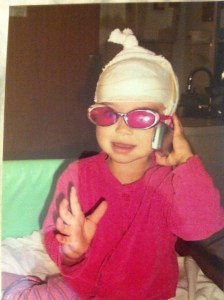 Day four of a week-long hospital stay for a video EEG. She's pretending to talk to her neurosurgeon on the phone.